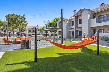 Courtyard with hammocks and fire pit